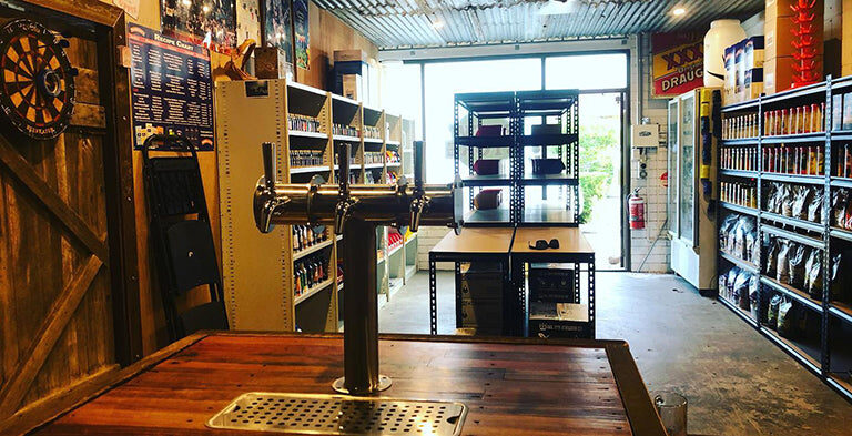 Inside The Brew Store Noosaville — tasting taps, ingredient shelves and the open roller door